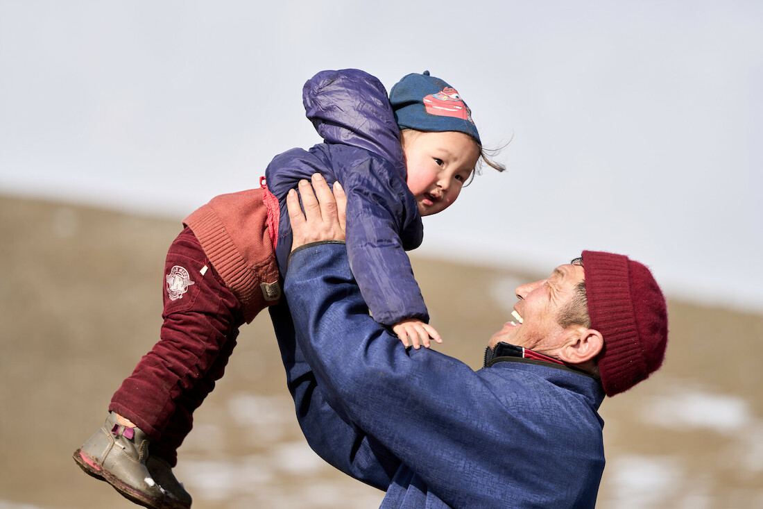 Buyanjargal and his granddaughter Anar at home in Mongolia. During the country’s lockdown, some herder families have been separated from the children they send to school. Credit: Gavi/2021/Khasar Sandag