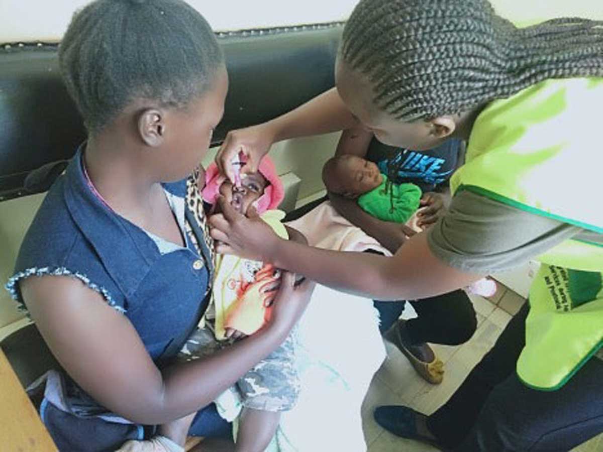 A child in Kivumbini receives a dose of the oral rotavirus vaccine. Credit: Stephen Mwangi, Nakuru County press