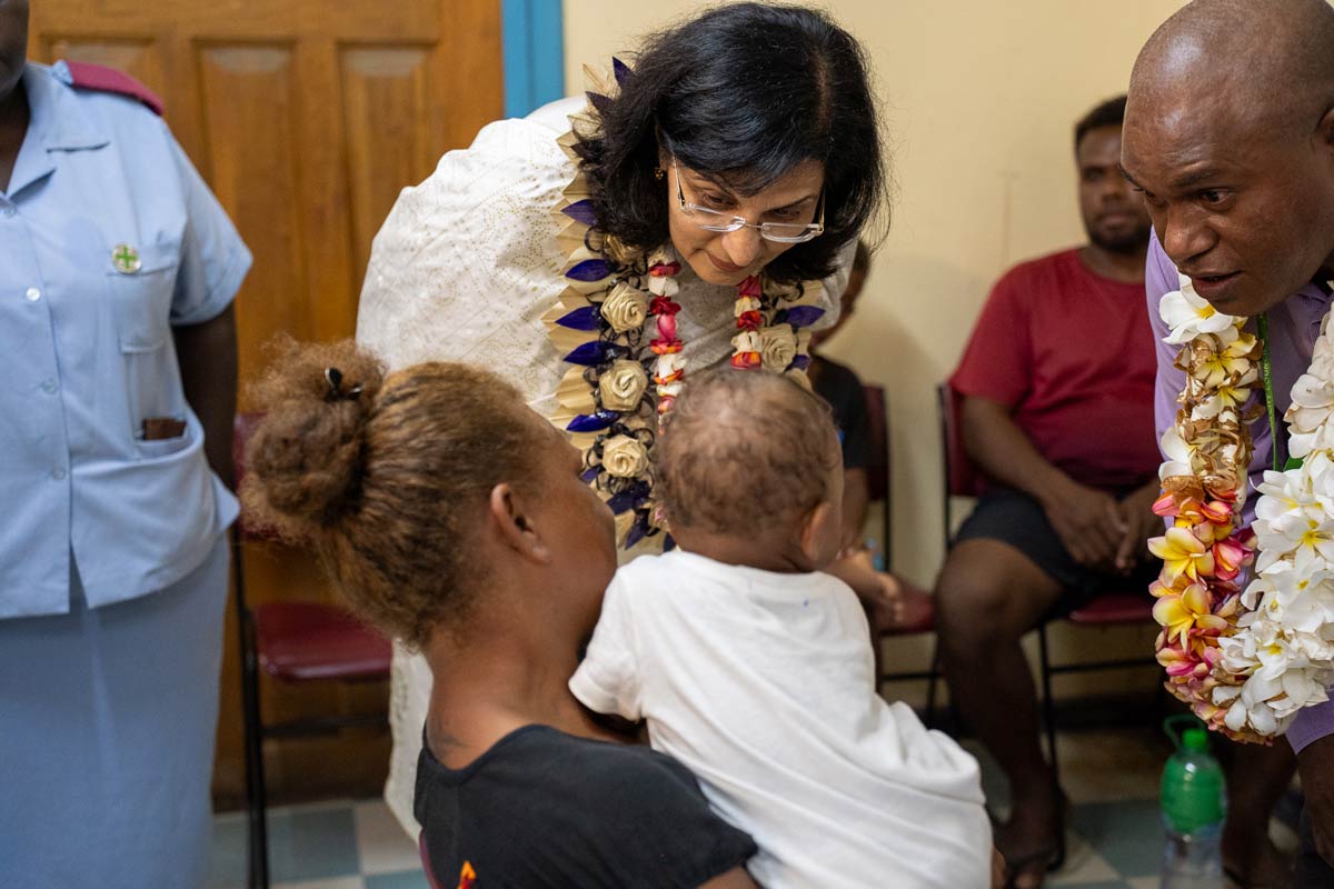 Gavi CEO Dr Sania Nishtar visits with families in a clinic in the Solomon Islands. Credit: Gavi/2024