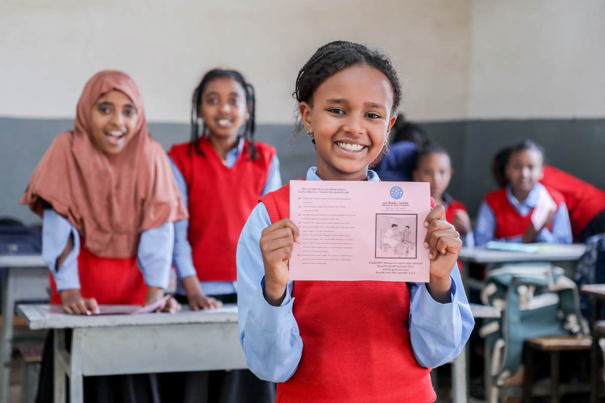 A student from Kebron Academy, Holeta Town in Ethiopia holds her HPV vaccination card. IFFIm has contributed US$ 132 million to Gavi’s HPV programmes. Credit: UNICEF Ethiopia/2024