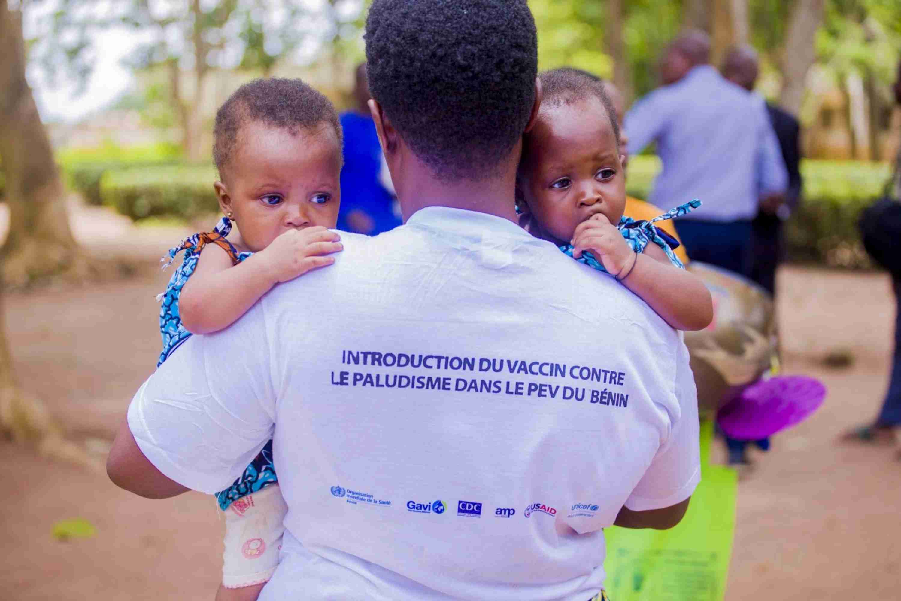 A mother holding her two children during the introduction of the malaria vaccine in Benin. Credit: Ministry of Health