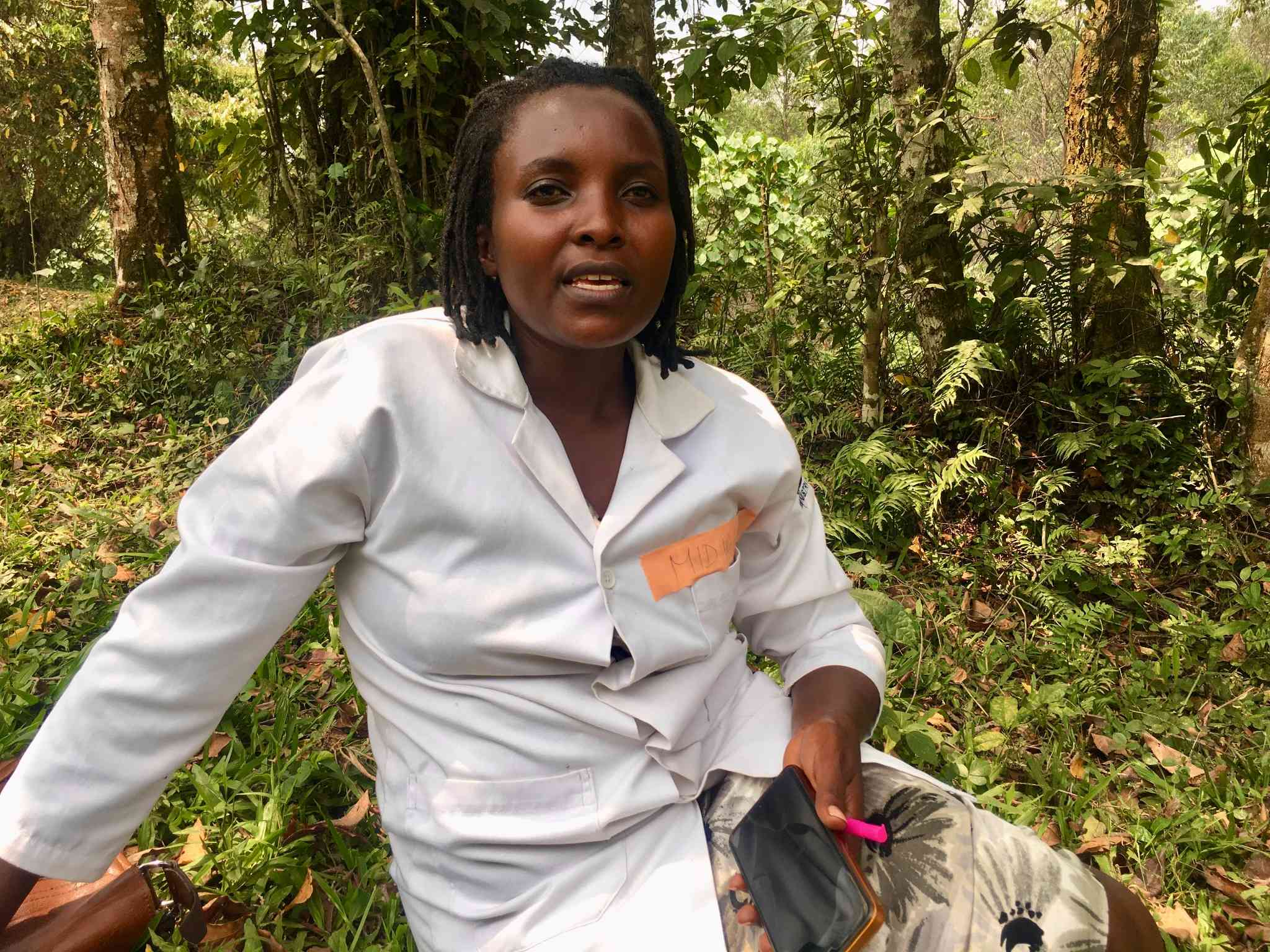 Sylvia Nyasuku. The midwife walks from tea plantation to tea plantation in Kanungu district searching for and vaccinating zero-dose children. Credit: John Agaba