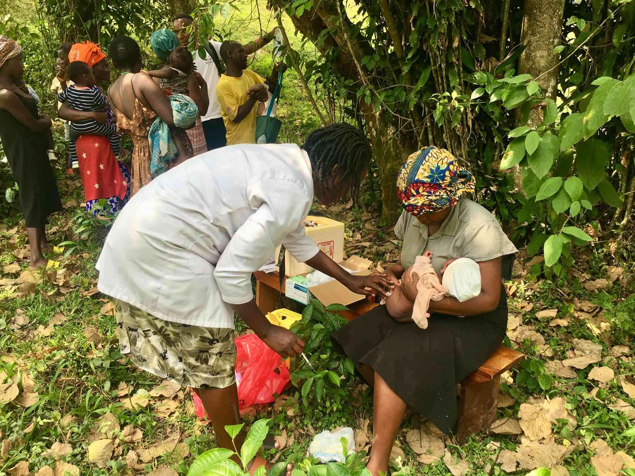 Sylvia Nyasuku after injecting a baby. She says vaccines have helped to control measles, diarrhoea and other VPDs in hard-to-reach tea communities in Uganda. Credit: John Agaba