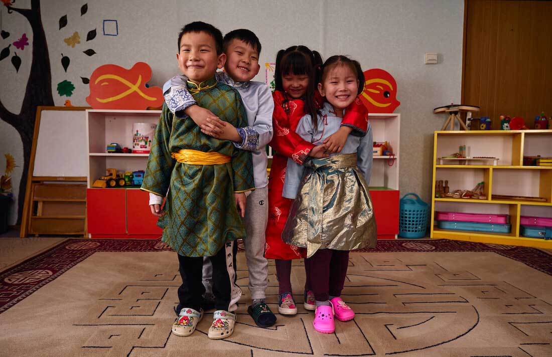 Smiling children in Mongolia from the front page of the IFFIm Resource Guide. Credit: Gavi/2023/Khasar Sandag.